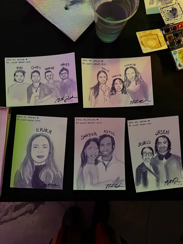 Five finished five-minute watercolor guest portraits laid out on a table beside a paint palette and water glass