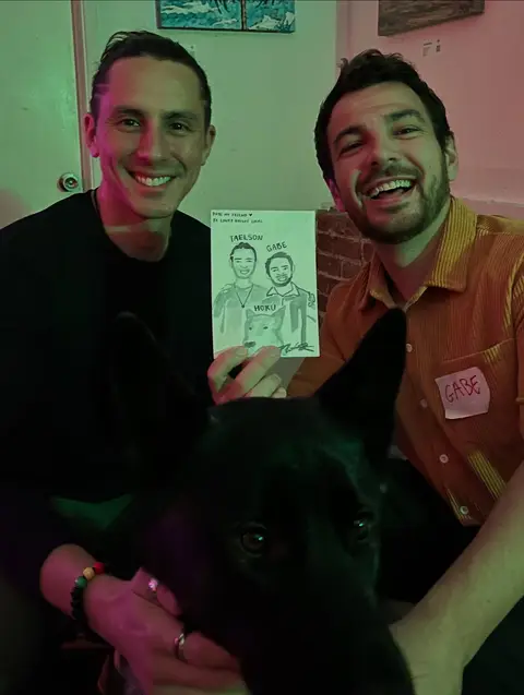 Two guests and their dog with a live watercolor portrait that includes all three of them